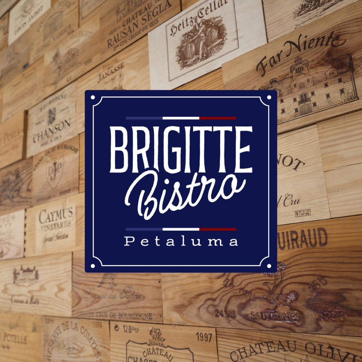 Brigitte Bistro navy logo sign on the wine crate wall
