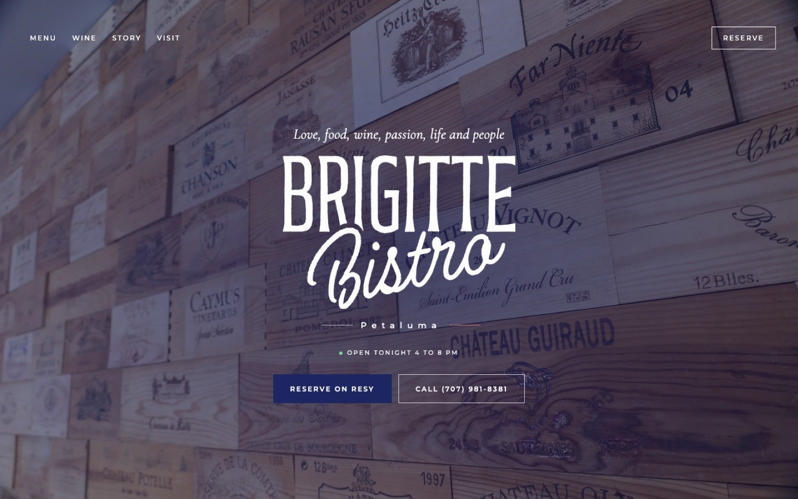New Brigitte Bistro home page with the logo over the wine crate wall