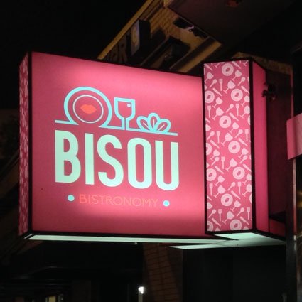Bisou Bistronomie illuminated sign at night